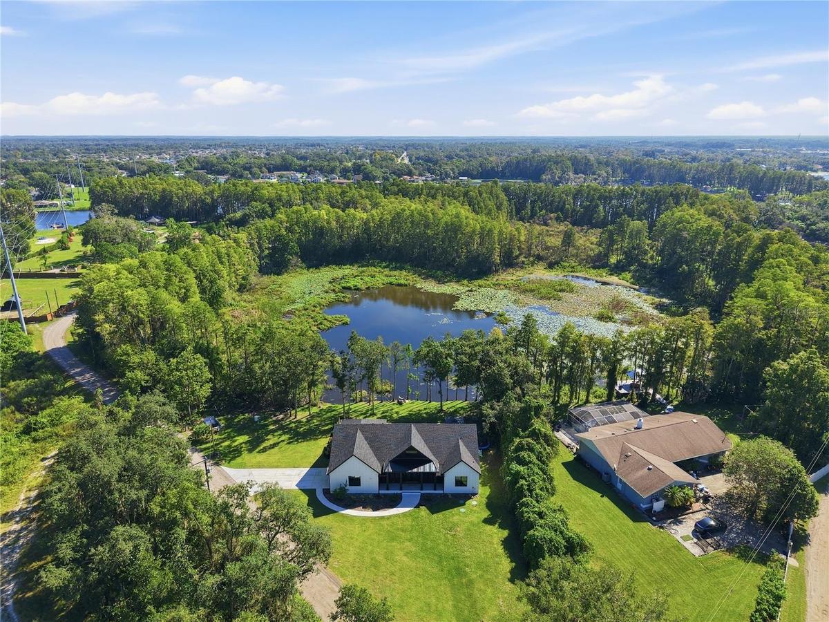 Sitting on 1.7 lakefront acres, tucked away in the heart of Land O Lakes