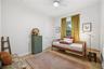 Bedroom number three with large walk-in closet.