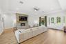Tons of natural lights and stone detailed electric fireplace.