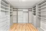 CUSTOM CALIFORNIA CLOSET (EN SUITE TO PRIMARY BEDROOM)