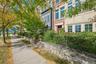Tree lined sidewalk that leads to the Scenic Hudson Rivewalk Park