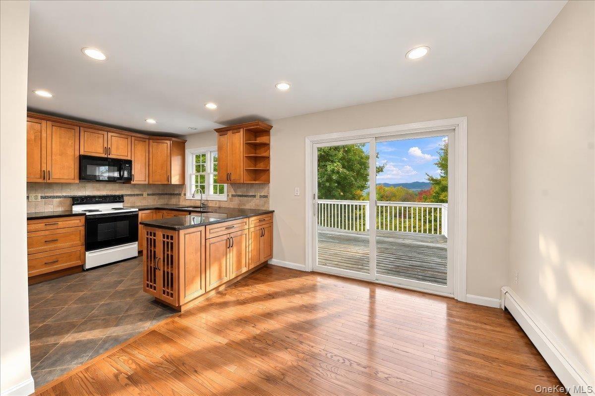 Open-concept kitchen seamlessly connected to the dining room, creating an inviting flow for everyday living and entertaining.