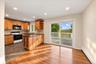 Open-concept kitchen seamlessly connected to the dining room, creating an inviting flow for everyday living and entertaining.
