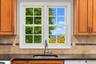 A kitchen window above the sink frames beautiful Hudson River views, making even everyday moments a little more scenic.
