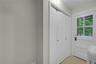 Backdoor hallway with closet