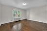 The larger of the two rooms. Bedroom or Living Room / Office, you choose