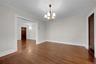 Another large room on main-level. Front door to left, door to Kitchen on right