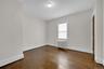 The smaller of the two rooms. Bedroom or Living Room / Office, you choose