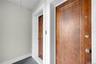 Doorways to the 3-bed duplex on the right/West-side, and the 1-bed first floor unit on the left side