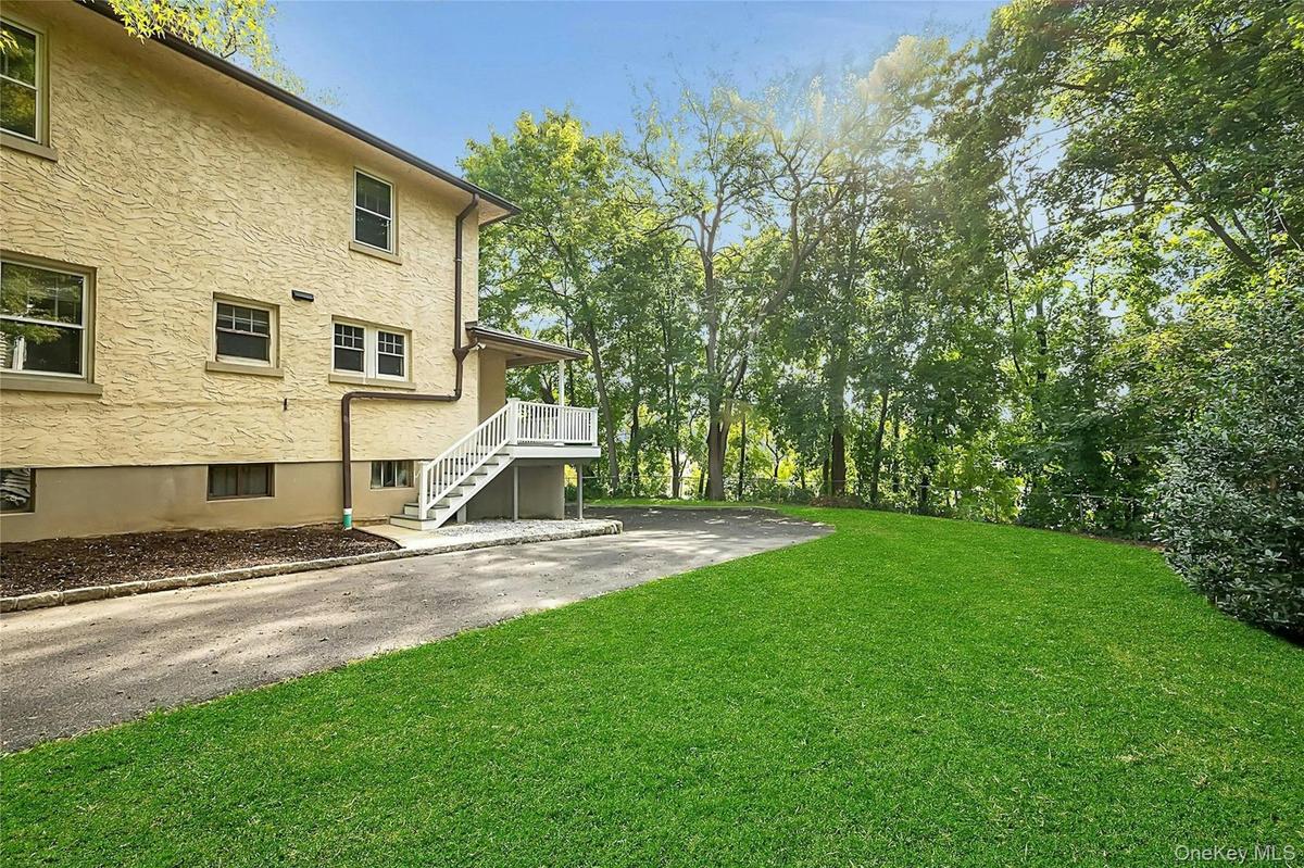 Staircase leads to rear entrances of both the 3-bed duplex and the 1-bed first floor unit