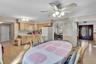 Kitchen featuring wood cabinetry, laminate countertops, and wood-finish flooring