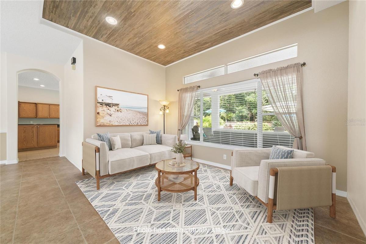Directly in front of you when you walk in will be the formal living space (photo virtually staged).