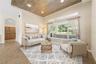 Directly in front of you when you walk in will be the formal living space (photo virtually staged).