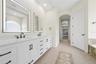 Walk past the two walk-in closets and into your primary bathroom with a water closet for your privacy.