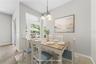 Here is the quaint breakfast nook or if you prefer a dinette for your family or smaller gatherings (photo virtually staged).