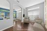 On to the private primary suite and when you first walk in you'll find a sitting room so you can peacefully enjoy the quiet (photo vitually staged).