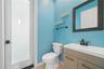 In this area is a convenient 1/2 bath that will also take you out to the pool area.