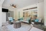 Right outside the family room sliding door is this spacious lanai where you can spend rainy days under cover, take a break from the bright sunshine, o