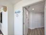 Welcome home.  Foyer view of hallway closet as you're entering paradise.