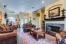 Light, bright and welcoming with fireplace as focal point