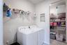 Laundry room with extra storage closet and plumbing hookups for uitlity sink