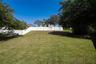 Additional yard space beyond the existing fence