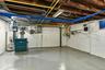 basement utility room with storage