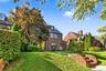 landscaping includes trees and plantings