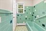 Separate tub area with a private entrance to the primary bedroom, offering added convenience.
