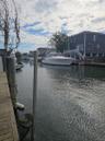 Waterfront property featuring a wood-plank bulkhead and pilings