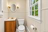 Conveniently located and updated lower-level half bath, easily accessible from both the recreation room and family room.