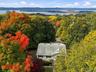 Front view of the home showcasing its charming exterior and beautiful Hudson River views.