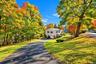 Long driveway offering ample off-street parking and leading to the convenience of a one-car garage.