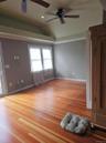 Vaulted ceilings with recessed lighting, wood-finish flooring, and dual ceiling fans