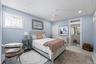 Recessed lighting, ceiling fan with integrated light, large-format tile flooring, and interior door with transom window