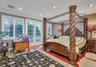 Room featuring cherry-finished hardwood flooring, crown molding, recessed lighting, and double glass-paned doors with exterior access
