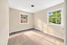 Bright, refreshed bedroom featuring brand-new carpeting and a fresh coat of paint, creating a clean and inviting space.
