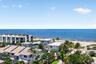 Expansive oceanfront setting featuring a sandy beach, deep blue ocean, and mature palm trees