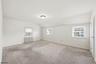 Primary Bedroom with carpeting