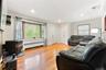 Living Room with bay window, recess lighting and hardwood floors.