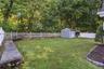 Yard with lawn and shed