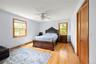 Bedroom with light wood-style flooring and ceiling fan