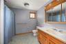 Full bath with vanity and curtained shower