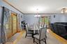 Dining space featuring a chandelier, light wood finished floors, and ornamental molding