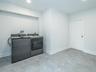 1st Floor: Large laundry room, with plenty of space for the room to multi task!