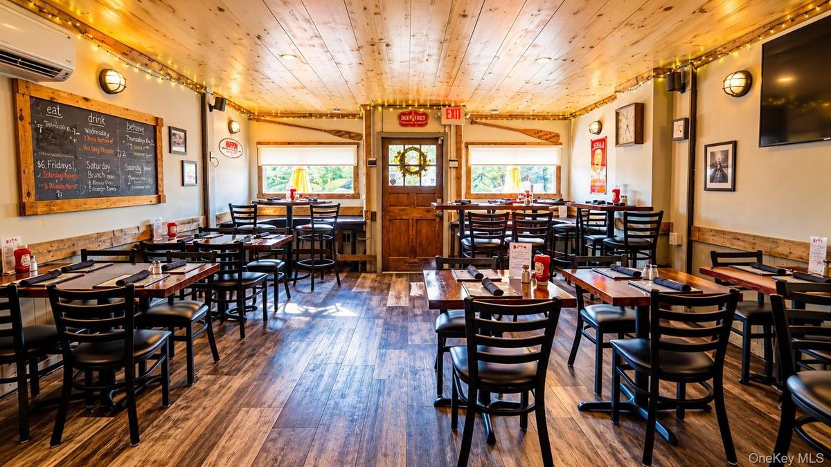 WritingAnother inviting view of the Tavern’s indoor dining area, where great food, warm hospitality, and a welcoming atmosphere have brought the commu