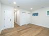 1st Floor: Primary bedroom (open door leads to en-suite bathroom)