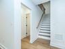 Stairs leading to the 2nd floor with an additional 2 beds + 1 bath