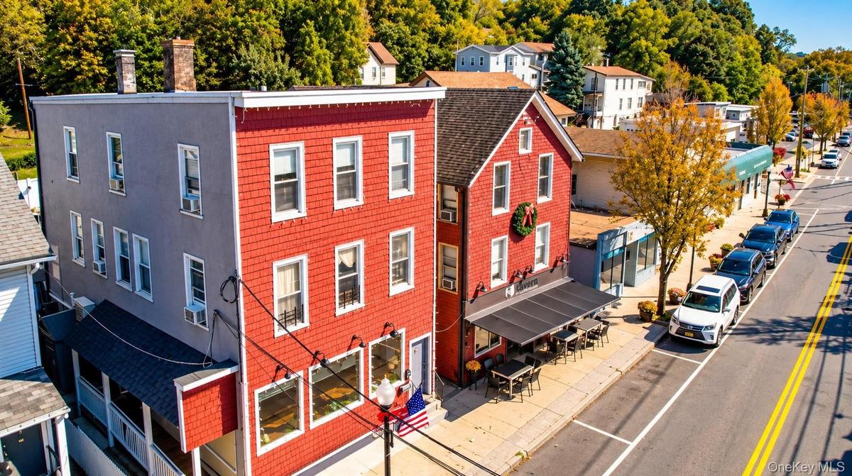 This turnkey property offers an exceptional investment opportunity, featuring two buildings, each with two-bedroom rental apartments, an established r
