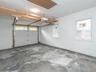 Poured concrete floor, pull down for attic and electrical box live here